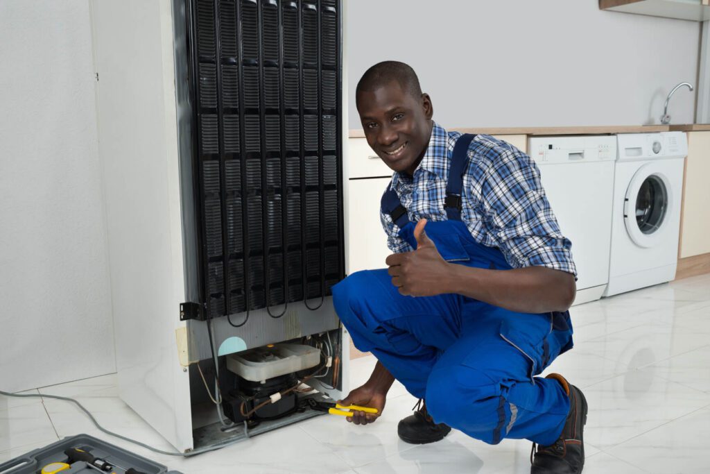 technician-fixing-refrigerator-m
